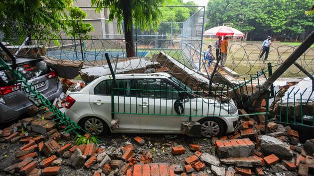 Cars under the rubble of a school’s boundary wall after it collapsed during heavy rain in Saket, New Delhi on August 19. At least seven parked cars were damaged after a portion of the boundary wall of Apeejay School in Saket’s J-block collapsed due to heavy rain around 11.30 am. Deputy Commissioner of police (south) Atul Kumar Thakur told HT that nobody was hurt in the accident. (Amal KS / HT Photo) Cars under the rubble of a school’s boundary wall after it collapsed during heavy rain in Saket, New Delhi on August 19. At least seven parked cars were damaged after a portion of the boundary wall of Apeejay School in Saket’s J-block collapsed due to heavy rain around 11.30 am. Deputy Commissioner of police (south) Atul Kumar Thakur told HT that nobody was hurt in the accident. (Amal KS / HT Photo)