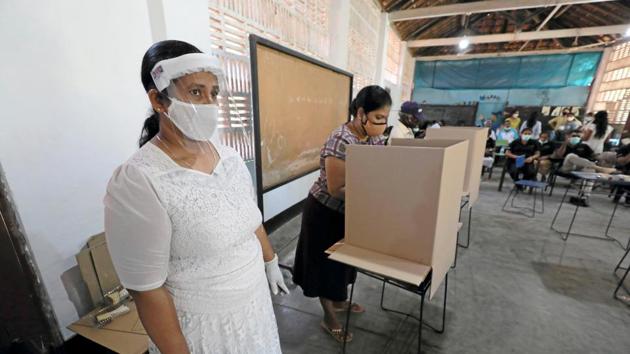 Image result for image of voting people gujarat with mask