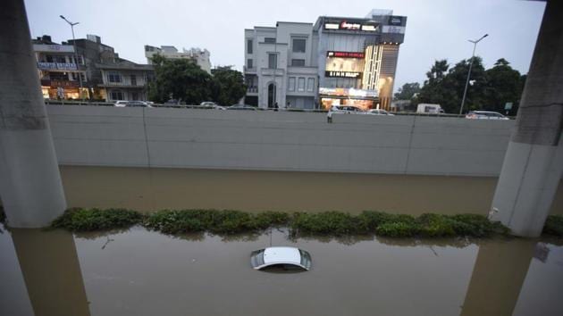 A car seen submerged at Golf Course Road underpass following heavy rain in Gurugram on August 19. The rains in Gurugram flooded many streets, turning them into small rivers. Vehicles were seen marooned on inundated roads or submerged under water in the city, PTI reported. (Parveen Kumar / HT Photo) A car seen submerged at Golf Course Road underpass following heavy rain in Gurugram on August 19. The rains in Gurugram flooded many streets, turning them into small rivers. Vehicles were seen marooned on inundated roads or submerged under water in the city, PTI reported. (Parveen Kumar / HT Photo)