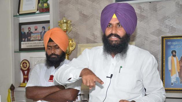 Lok Insaaf Party president Simarjit Singh Bains and other party members addressing media persons at his office in Ludhiana on Wednesday.(Gurpreet Singh/HT)