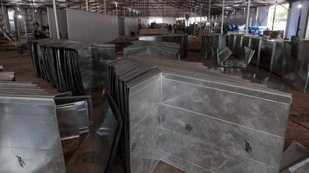 Work in progress of building the jumbo Covid facility on COEP ground in Pune. The work is delayed due to heavy rain last week in Pune, India, on Monday, August 17, 2020.(Rahul Raut/HT PHOTO)