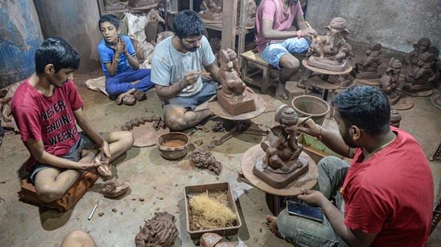 Galwani’s staff work on clay idols of Ganesha at his workshop in Kumbharwada, Mumbai on August 15. Ganesh Chaturthi festival which kicks-off on August 22, traditionally ends with devotees leading massive processions to the Arabian Sea to immerse elaborately decorated figurines of the much-loved elephant god into the water. (Indranil Mukherjee / AFP)