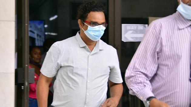 Sunil Kumar Nandeshwar, captain of the MV Wakashio, a bulk carrier ship that recently ran aground off the southeast coast of Mauritius, is seen outside the courthouse in Port Louis on Tuesday.(AP Photo)