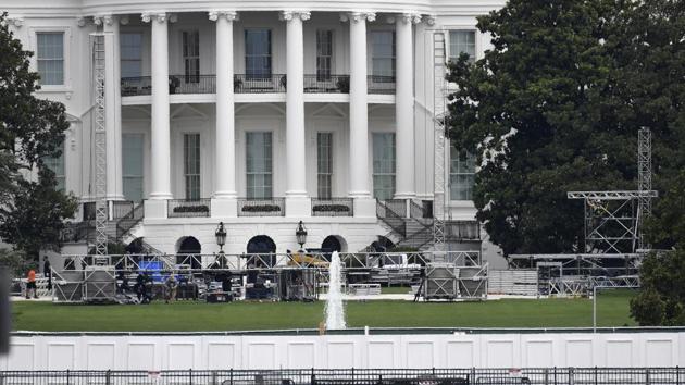 Workers construct staging on the South Lawn of the White House in Washington.(AP File Photo)
