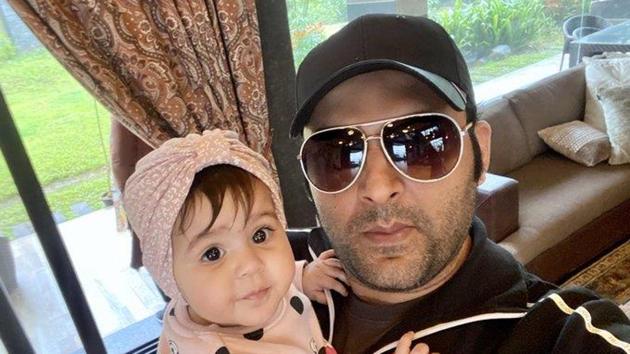 Kapil poses with daughter Anayra.