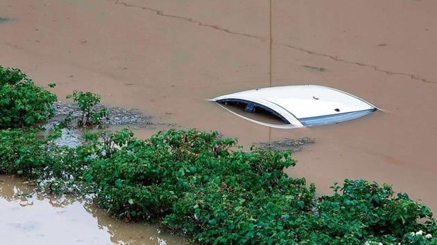 A submerged car is seen in a flooded underpass at Gurugram’s Golf Course Road after heavy monsoon rain in NCR on Wednesday.(AFP Photo)