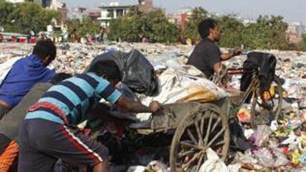 Gurugram, India-Dec 16, 2018: Ragpickers at work at a dumping ground, at Nathupur village, near DLF Phase 3, in Gurugram, India, on Sunday, December 16, 2018. (Photo by Yogendra Kumar / Hindustan Times) To go with Prayag Arora’s story (HT PHOTO/For representation)