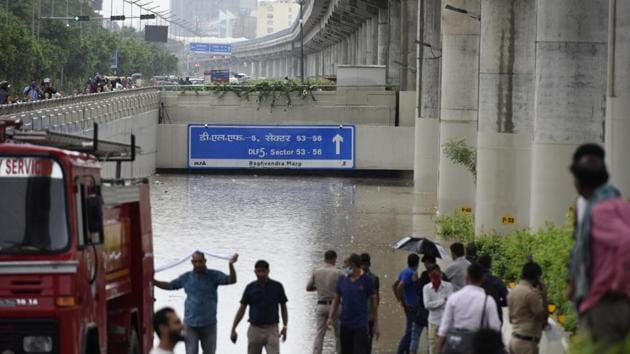 The Golf Course Road underpass was completely inundated following heavy rain in Gurugram on Wednesday.(Parveen Kumar/HT Photo)