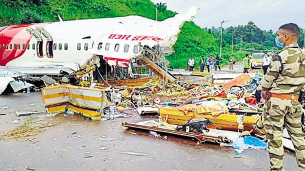 Officials inspect the wreckage of Air India Express flight at Kozhikode International Airport in Karipur.(ANI)