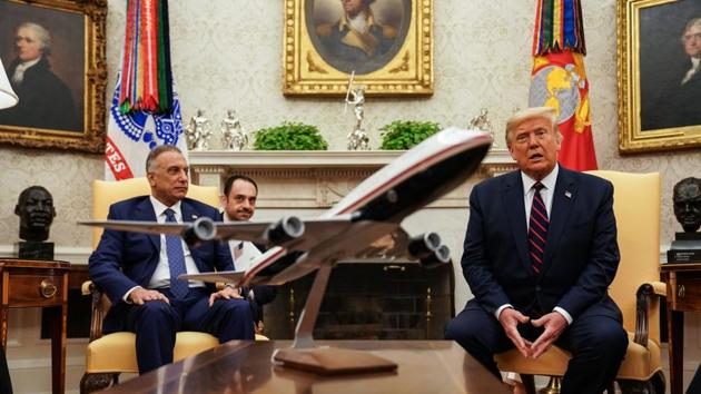 US President Donald Trump speaks while Mustafa al-Kadhimi, Iraq's prime minister, left, listens during a meeting in the Oval Office at the White House in Washington, DC.(Bloomberg)
