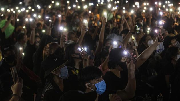 Protesters display mobile phones with flash lights on during a protest at Democracy Monument in Bangkok on August 16. The United Nations children’s organization (UNICEF) issued a statement calling for all parties to ensure that those involved remain safe and able to express their opinions peacefully without fear or intimidation, reported AP. (Sakchai Lalit / AP)