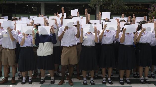 High school students demonstrate at Samsen Wittayalai School in Bangkok on August 18. Apart from political demands, some pupils complain of a school system which emphasizes obedience and tradition, from lining up daily for the national anthem to strict rules on uniforms, haircuts and behaviour. A system with “highly authoritarian elements,” Prajak Kongkirati, a political scientist at Thammasat University told Reuters. (Sakchai Lalit / AP)
