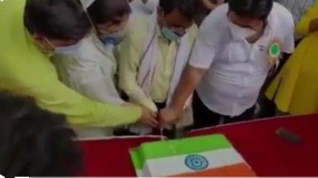 TMC leaders involved in the cake cutting say it was an expression of celebration on Independence Day.(Grab from a sourced video)