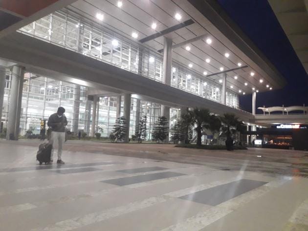A lone passenger stands at Chandigarh International Airport, which has incurred huge losses as flights were curtailed during the Covid-19 outbreak.(HT photo)