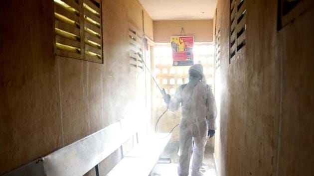 BMC workers sanitize BMC health center at Chembur during Covid-19 pandemic in Mumbai on Thursday.(Satish Bate/HT Photo)