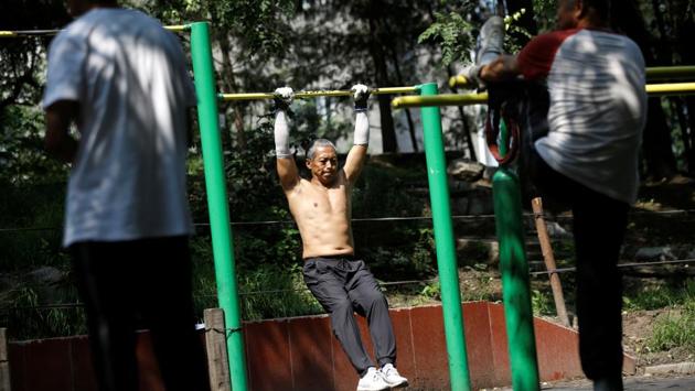 A man exercises at a park, after the lifting of mandatory face mask requirements in Beijing on August 21. Authorities reported 22 imported cases in the mainland on for August 20, and has closed its borders to most non-Chinese citizens. The country has reported a total of 84,917 cases since the outbreak began. (Tingshu Wang / REUTERS)