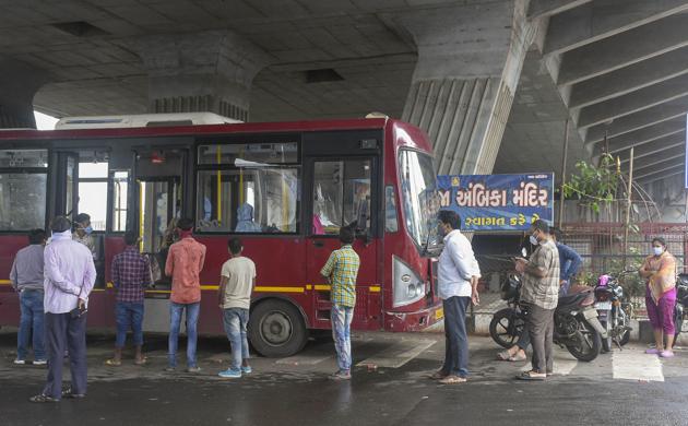 People wait in a queue for the Covid-19 test, in Surat, Gujarat, on August 20.(PTI)