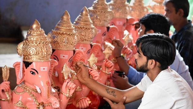 Artisans give final touch to idols of Lord Ganesha on the eve of Ganesh Chaturthi festival, in Chikmagalur, Friday, Aug. 21, 2020. (Representational)(PTI)