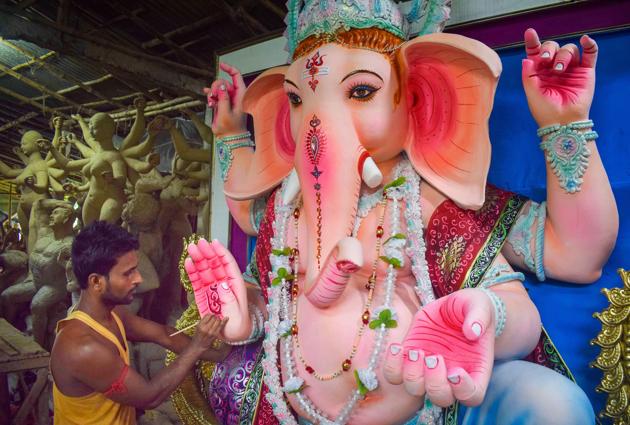 Nadia: An artisan gives final touch to idols of Lord Ganesha on the eve of Ganesh Chaturthi festival, in Nadia district, Friday, Aug. 21, 2020. (PTI Photo)(PTI21-08-2020_000036B) (PTI) Nadia: An artisan gives final touch to idols of Lord Ganesha on the eve of Ganesh Chaturthi festival, in Nadia district, Friday, Aug. 21, 2020. (PTI Photo)(PTI21-08-2020_000036B) (PTI)