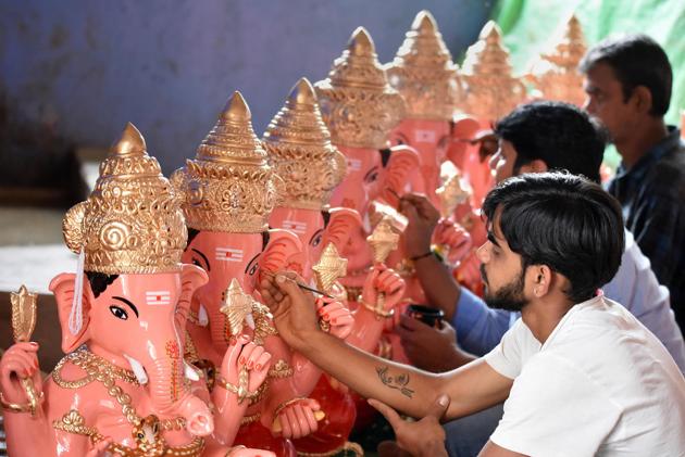 Chikmagalur: Artisans give final touch to idols of Lord Ganesha on the eve of Ganesh Chaturthi festival, in Chikmagalur, Friday, Aug. 21, 2020. (PTI Photo)(PTI21-08-2020_000035A) (PTI) Chikmagalur: Artisans give final touch to idols of Lord Ganesha on the eve of Ganesh Chaturthi festival, in Chikmagalur, Friday, Aug. 21, 2020. (PTI Photo)(PTI21-08-2020_000035A) (PTI)