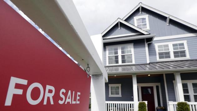 A "For Sale" sign stands in front of a home that is in the process of being sold in Monroe, Washington, outside of Seattle. (AP) A "For Sale" sign stands in front of a home that is in the process of being sold in Monroe, Washington, outside of Seattle. (AP)