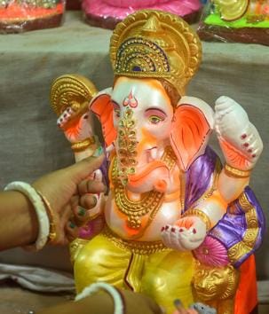Kolkata: An artisan gives final touch to idols of Lord Ganesha on the eve of Ganesh Chaturthi festival, at Kumartuli in Kolkata, Friday, Aug. 21, 2020. (PTI Photo/Ashok Bhaumik)(PTI21-08-2020_000043B) (PTI) Kolkata: An artisan gives final touch to idols of Lord Ganesha on the eve of Ganesh Chaturthi festival, at Kumartuli in Kolkata, Friday, Aug. 21, 2020. (PTI Photo/Ashok Bhaumik)(PTI21-08-2020_000043B) (PTI)