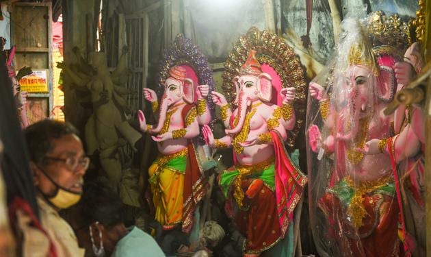 Kolkata: Artisans gives final touch to idols of Lord Ganesha on the eve of Ganesh Chaturthi festival, at Kumartuli in Kolkata, Friday, Aug. 21, 2020. (PTI Photo/Ashok Bhaumik)(PTI21-08-2020_000042B) (PTI) Kolkata: Artisans gives final touch to idols of Lord Ganesha on the eve of Ganesh Chaturthi festival, at Kumartuli in Kolkata, Friday, Aug. 21, 2020. (PTI Photo/Ashok Bhaumik)(PTI21-08-2020_000042B) (PTI)