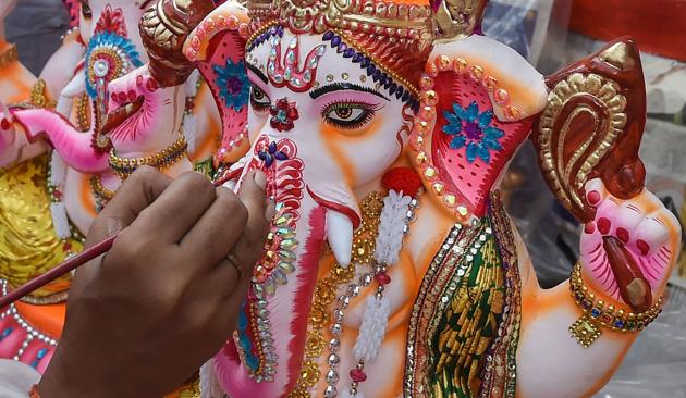 Kolkata: An artist gives finishing touch to an idol of lord Ganesha ahead of Ganesh Chaturthi festival, in Kolkata, Sunday, Aug. 16, 2020. (PTI Photo/Swapan Mahapatra)(PTI16-08-2020_000091B) (PTI) Kolkata: An artist gives finishing touch to an idol of lord Ganesha ahead of Ganesh Chaturthi festival, in Kolkata, Sunday, Aug. 16, 2020. (PTI Photo/Swapan Mahapatra)(PTI16-08-2020_000091B) (PTI)