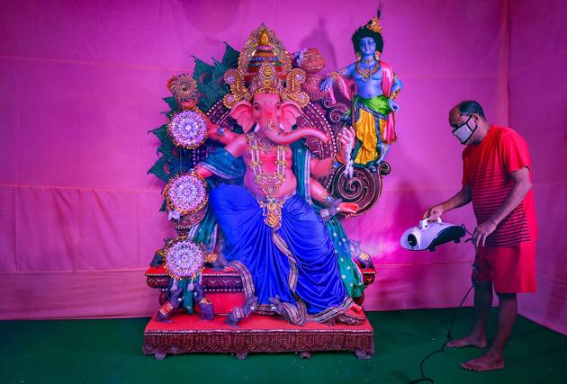 Kolkata: A man sprays disinfectants on a pandal ahead of Ganesh Chaturthi festival, during the biweekly lockdown to curb COVID-19 spread, in Kolkata, Thursday, Aug 20, 2020.(PTI Photo/Swapan Mahapatra)(PTI20-08-2020_000039B) (PTI) Kolkata: A man sprays disinfectants on a pandal ahead of Ganesh Chaturthi festival, during the biweekly lockdown to curb COVID-19 spread, in Kolkata, Thursday, Aug 20, 2020.(PTI Photo/Swapan Mahapatra)(PTI20-08-2020_000039B) (PTI)