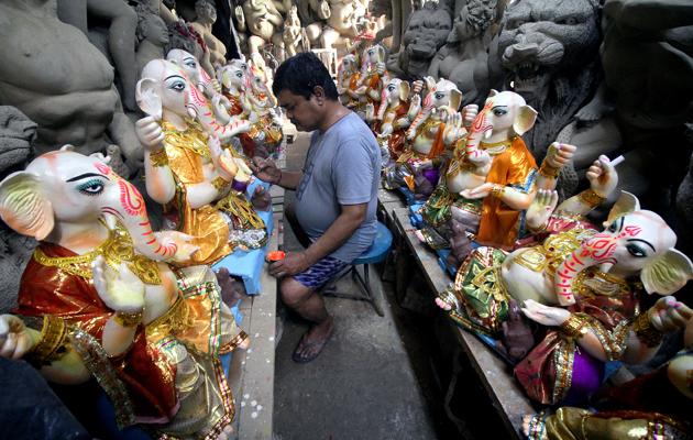 Uttar Pradesh, Aug 19 (ANI): An artist gives the final touch to the idol of Lord Ganesha ahead of the upcoming Ganesh Chaturthi Festival, in Lucknow on Wednesday. (ANI Photo) (ANI) Uttar Pradesh, Aug 19 (ANI): An artist gives the final touch to the idol of Lord Ganesha ahead of the upcoming Ganesh Chaturthi Festival, in Lucknow on Wednesday. (ANI Photo) (ANI)
