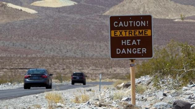 A sign warns of extreme heat as tourists enter Death Valley National Park in California.(Reuters File Photo) A sign warns of extreme heat as tourists enter Death Valley National Park in California.(Reuters File Photo)