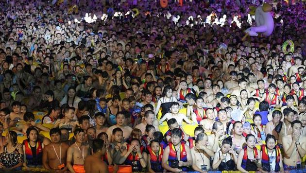 Thousands of people attended an outdoor rave in a water park in Wuhan, China, over the weekend, eight months after Chinese virus was first detected in the city.(REUTERS)