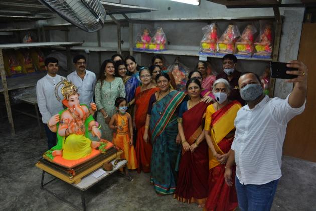 A family takes a selfie with their Lord Ganesh idol in their home in Thane, Maharashtra on August 22, 2020. (Praful Gangurde/HT photo) A family takes a selfie with their Lord Ganesh idol in their home in Thane, Maharashtra on August 22, 2020. (Praful Gangurde/HT photo)