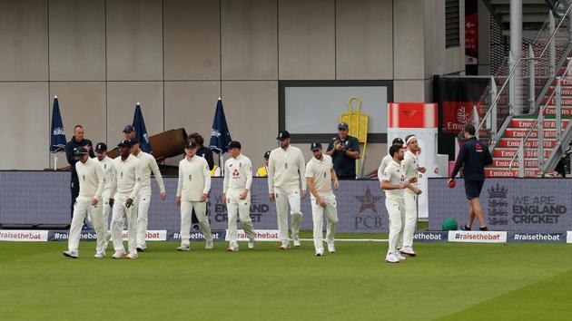 England's Jofra Archer walks out with the players before the start of play.(REUTERS)