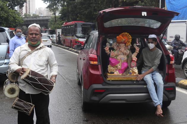 A boy sits holding an idol of elephant-headed Lord Ganesha in the trunk of a car during Ganesh Chaturthi festival celebrations in Mumbai, India, Saturday, Aug. 22, 2020. (AP) A boy sits holding an idol of elephant-headed Lord Ganesha in the trunk of a car during Ganesh Chaturthi festival celebrations in Mumbai, India, Saturday, Aug. 22, 2020. (AP)