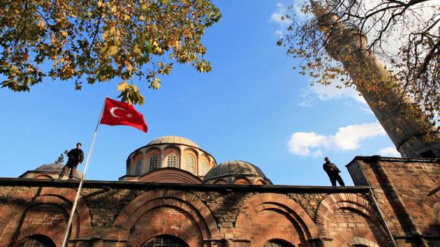 Turkish police officers stand guard atop the Kariye (Chora) museum, the 11th century church of St. Savior.(REUTERS)