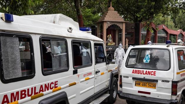 Ambulances with bodies of people, who died due to the coronavirus disease (COVID-19), are seen parked at a crematorium in New Delhi, India.(REUTERS)