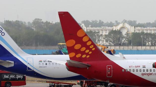 File photo: Aircraft operated by IndiGo, a unit of InterGlobe Aviation Ltd., SpiceJet Ltd. and AirAsia Bhd stand at Terminal 3 of Indira Gandhi International Airport in New Delhi.(Bloomberg)