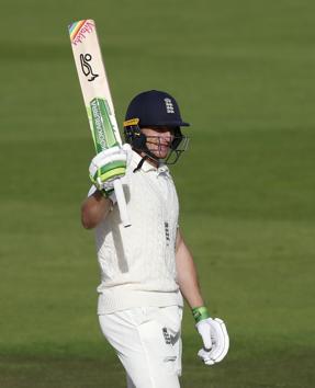 England's Jos Buttler raises his bat to celebrate scoring 150 runs during the second day of the third cricket Test match between England and Pakistan, at the Ageas Bowl in Southampton, England, Saturday, Aug. 22, 2020. (AP Photo/Alastair Grant, Pool) (AP)
