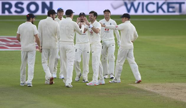 England's James Anderson, third right, celebrates with teammates the dismissal of Pakistan's Babar Azam during the second day of the third cricket Test match between England and Pakistan, at the Ageas Bowl in Southampton, England, Saturday, Aug. 22, 2020. (Mike Hewitt/Pool via AP) (AP)