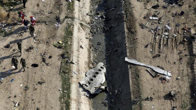 In this Jan. 8, 2020, file photo, rescue workers search the scene where an Ukrainian plane was shot down in Shahedshahr, southwest of Tehran, Iran. (AP photo) In this Jan. 8, 2020, file photo, rescue workers search the scene where an Ukrainian plane was shot down in Shahedshahr, southwest of Tehran, Iran. (AP photo)
