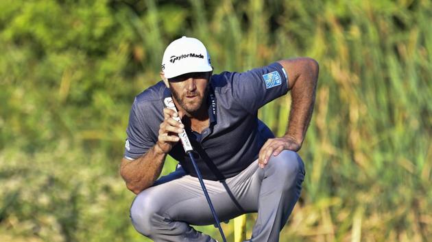 Aug 22, 2020; Norton, Massachusetts, USA; Dustin Johnson studies his putt on the 16th green during the third round of The Northern Trust golf tournament at TPC of Boston. Mandatory Credit: Mark Konezny-USA TODAY Sports(USA TODAY Sports)