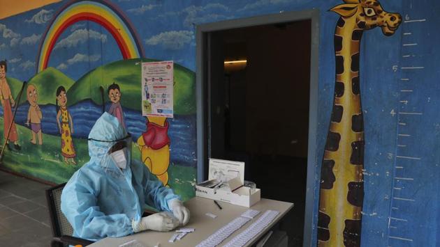 A health worker arranges rapid antigen test kits for coronavirus screening in Hyderabad on August 22. The number of coronavirus disease (Covid-19) cases in India crossed the 3 million mark on August 22, with the country reporting 69,239 new Covid-19 cases and 912 deaths according to the Union health ministry bulletin on August 23. (Mahesh Kumar A / AP)