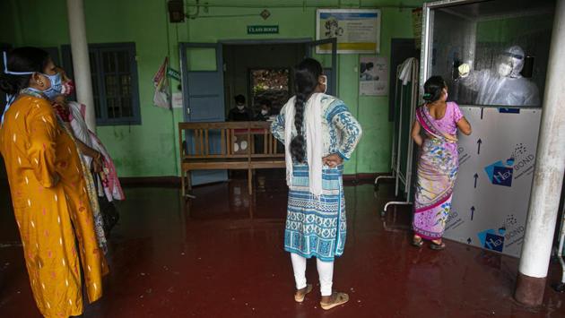 Women queue to give swab samples to test for Covid-19 infection in Guwahati on August 21. “As a result of various measures taken by the government, the outbreak situation in India is very much under control. The health care infrastructure is not overwhelmed, the testing capacity is more than enough to meet the demand and even the percentage of Covid-19 patients on ventilator is very minuscule,” a senior official of the health ministry told HT. (Anupam Nath / AP)