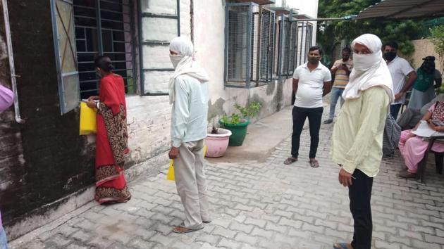 In Najafgarh, a camp in a Delhi government school saw several women stand in line, most of whom were related to the concerned applicant. (HT Photo) In Najafgarh, a camp in a Delhi government school saw several women stand in line, most of whom were related to the concerned applicant. (HT Photo)
