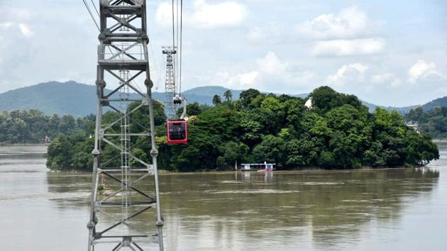 The 1.8-kilometre-long ropeway, built at a cost of ₹56 crore, extending from central to northern Guwahati, will reduce travel time between both banks to just eight minutes. (HT Photo) The 1.8-kilometre-long ropeway, built at a cost of ₹56 crore, extending from central to northern Guwahati, will reduce travel time between both banks to just eight minutes. (HT Photo)