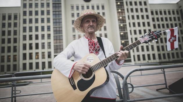 Ales Varhamiev, 62, a pensioner and singer, plays a guitar as he poses for a photo during an opposition rally in Independence Square in Minsk on August 20. Varhamiev brought his guitar to play the protesters’ anti-Lukashenko anthem “Cockroach, Get Out!” (Evgeniy Maloletka / AP) Ales Varhamiev, 62, a pensioner and singer, plays a guitar as he poses for a photo during an opposition rally in Independence Square in Minsk on August 20. Varhamiev brought his guitar to play the protesters’ anti-Lukashenko anthem “Cockroach, Get Out!” (Evgeniy Maloletka / AP)
