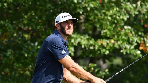 Aug 23, 2020; Norton, Massachusetts, USA; Dustin Johnson watches his tee shot on the 4th hole during the final round of The Northern Trust golf tournament at TPC of Boston. Mandatory Credit: Mark Konezny-USA TODAY Sports(USA TODAY Sports)