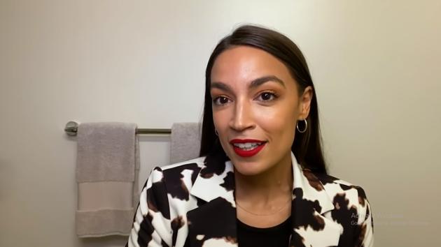 Alexandria Ocasio-Cortez guides viewers on her skincare regime and her signature red lipstick.(Vogue/YouTube Screen Grab)