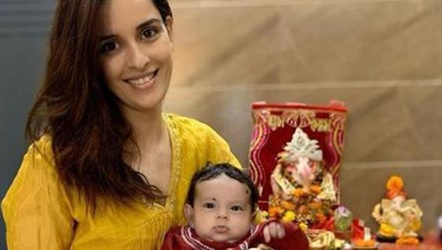 Model Ekta Kaul, wife of actor Sumeet Vyas, with their young son at their puja at home.
